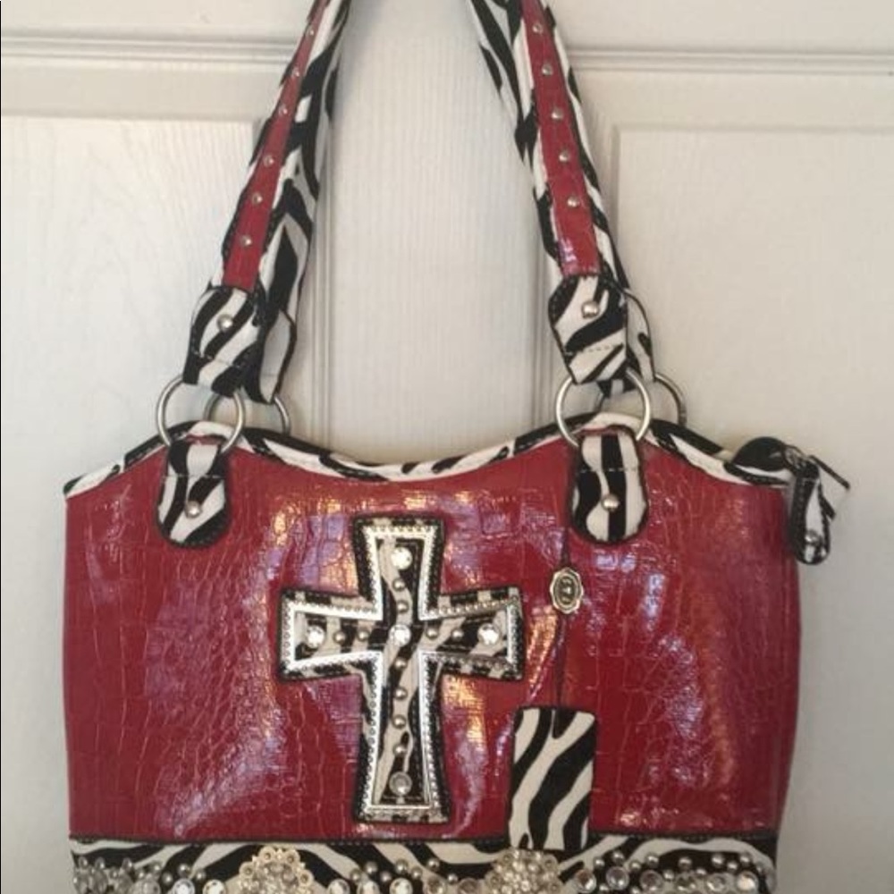 Red purse with cross and sequins
